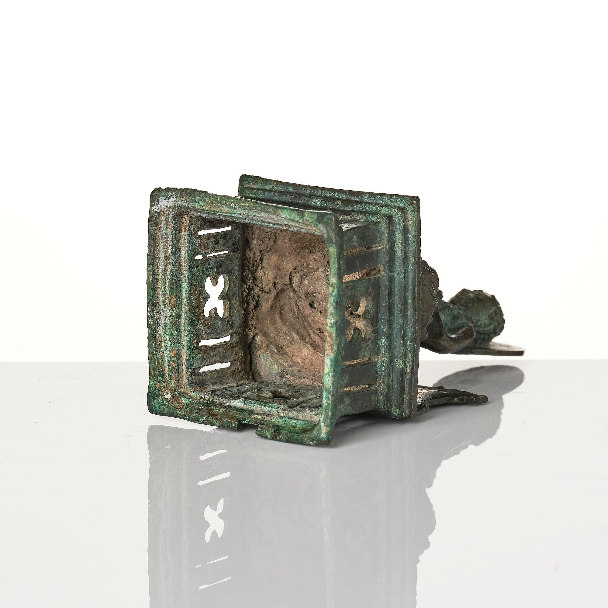 A bronze Buddha Vairocana, Eastern Java, 10th century.