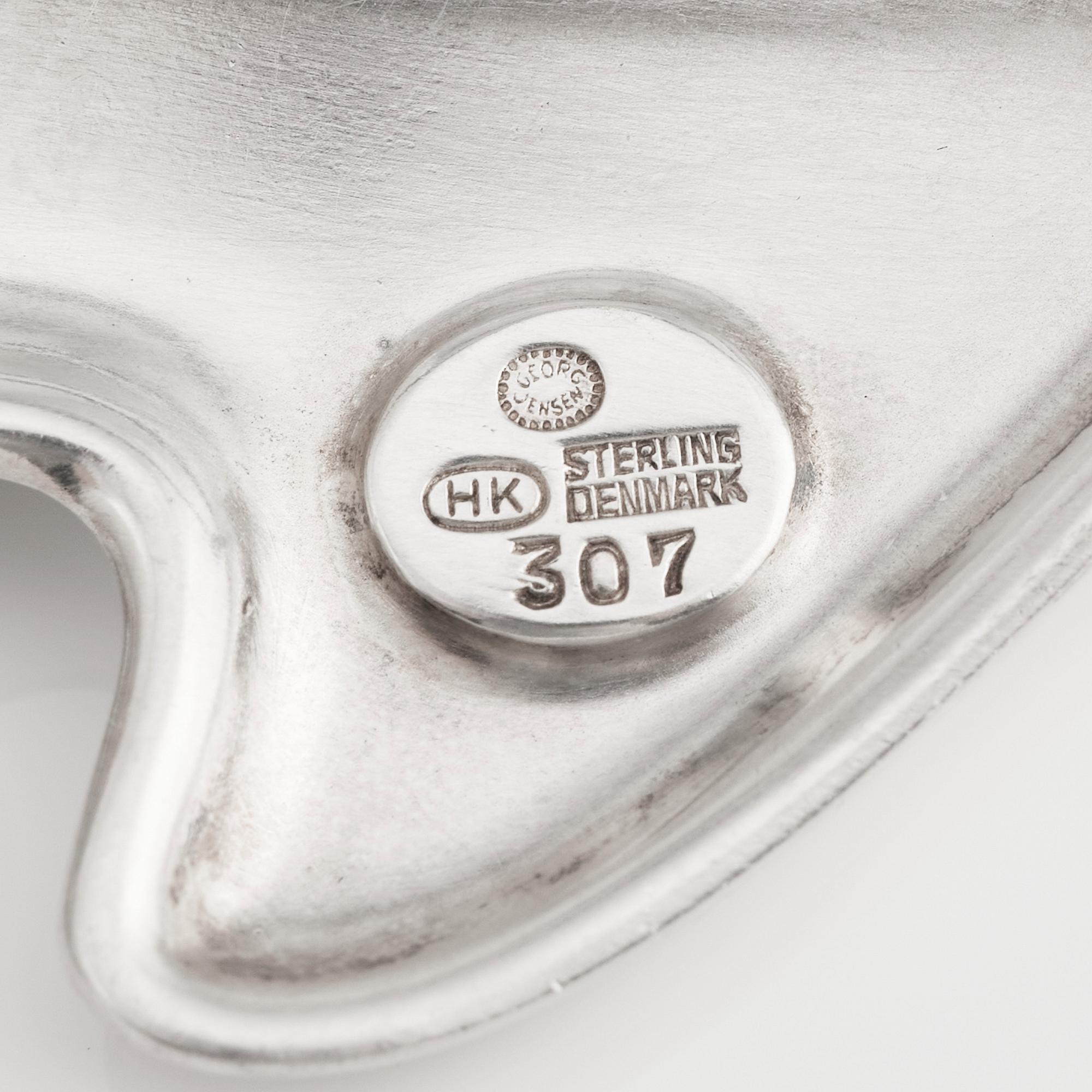 Henning Koppel, a sterling silver and dark brown enamel brooch, Georg Jensen, Copenhagen, Denmark, model 307.