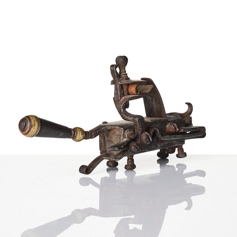 A mechanical flintlock igniter, later part 18th century/early19th century.