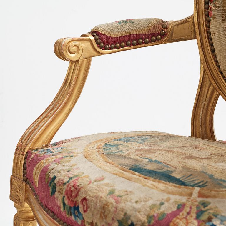 A set of four Louis XVI armchairs.