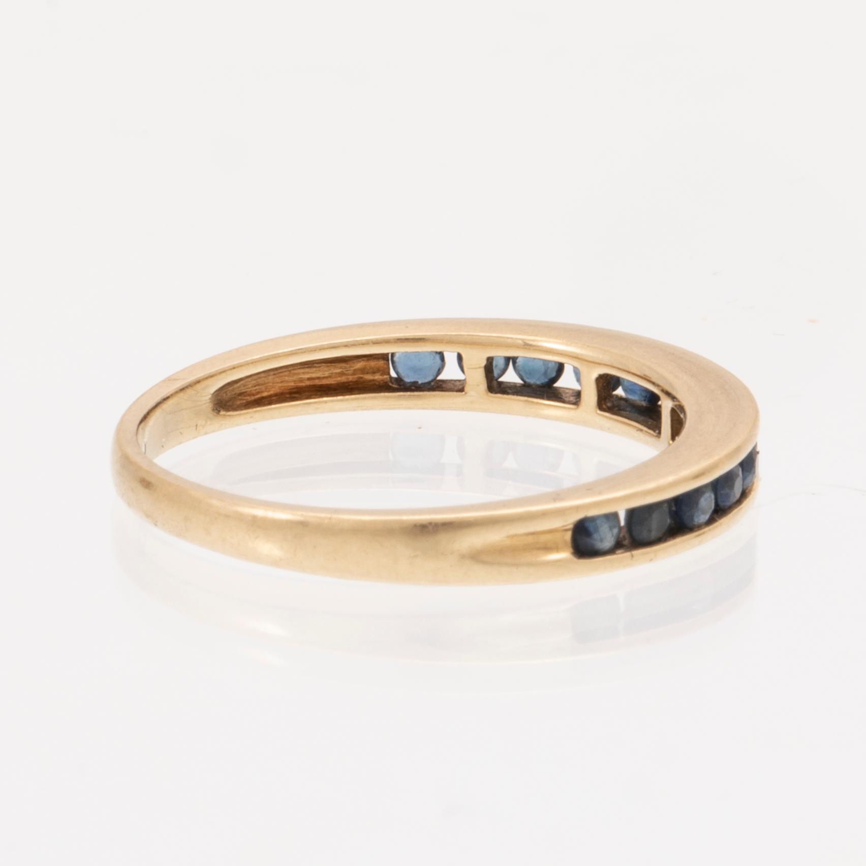 An 18K gold ring and a pair of earrings by H. Stern set with round brilliant cut diamonds and sapphires.