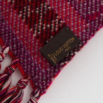 Louis Vuitton, a knitted cashmere hat and scarf.