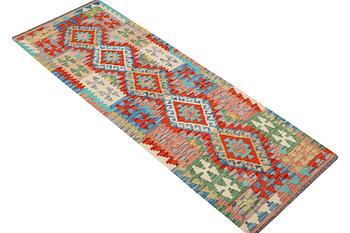 A Kilim runner, c. 297 x 81 cm.