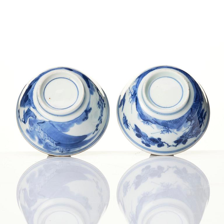 A matched set of eight blue and white cups and stands, Qing dynasty, Kangxi (1662-1722).