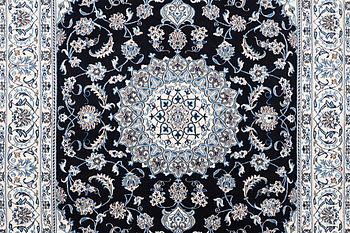 A carpet, nain part silk, ca 303 x 201 cm.