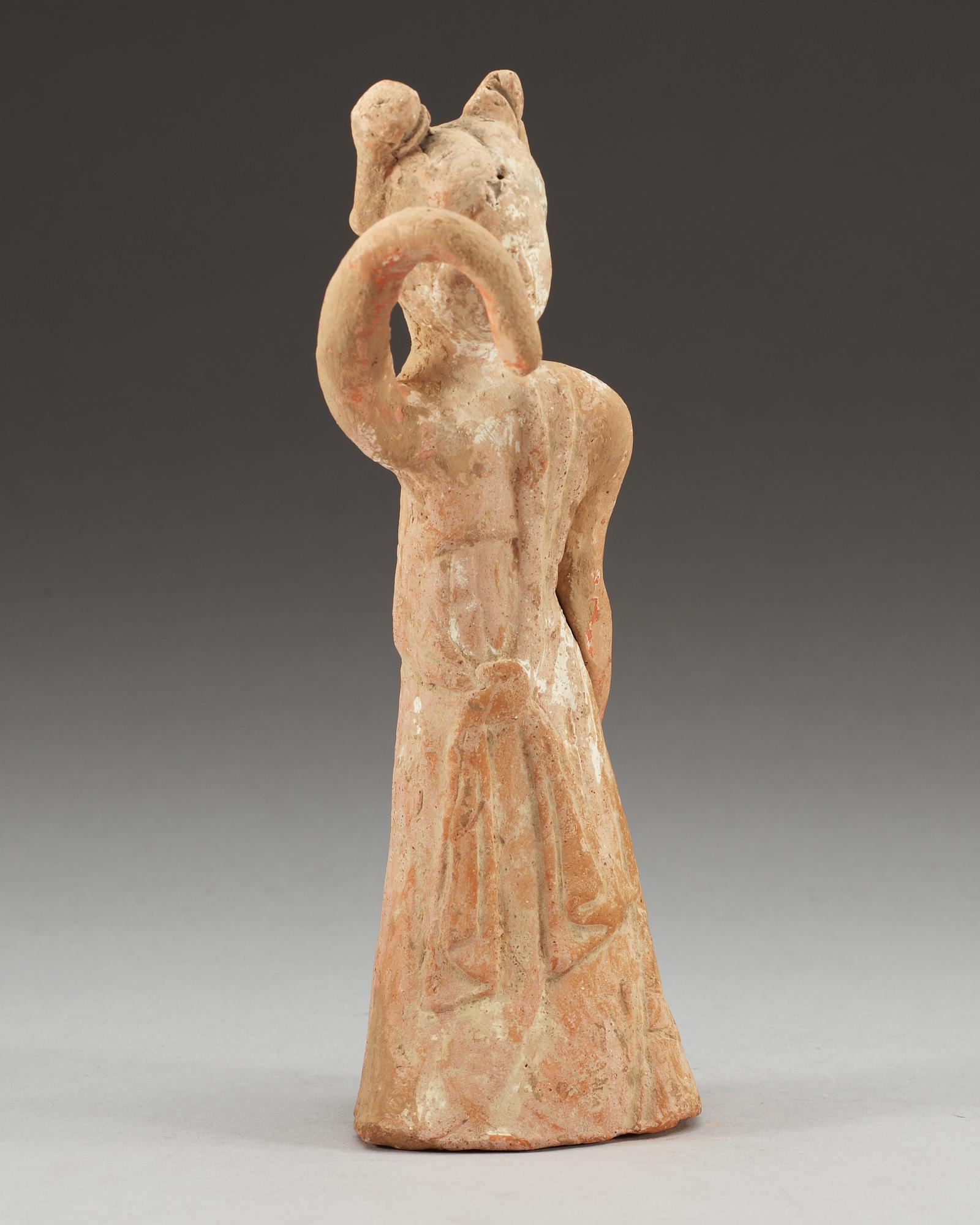 A potted figure of a dancer, Tang dynasty (618-907).