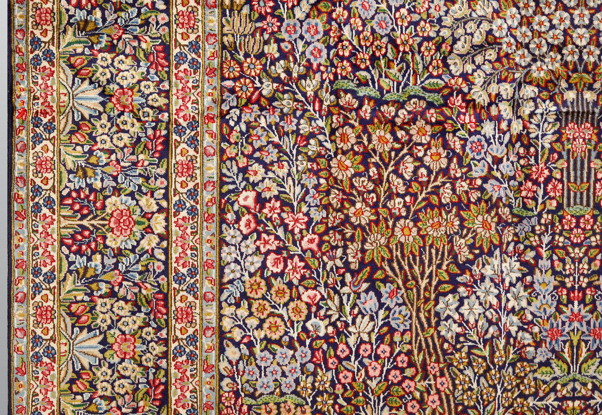 A Kirman Laver carpet, 'Millefleur', approx. 400 x 295 cm.