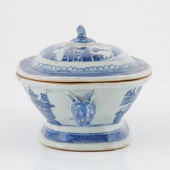 A blue and white tureen with cover, a plate and a butter tureen with cover and stand, China, 18th and 19th century.