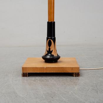 An elm floor light, mid 20th Century.
