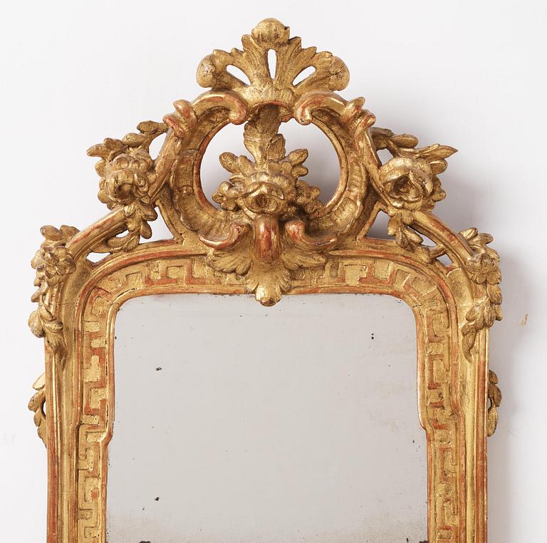 A Swedish rococo giltwood mirror, Stockholm, later part 18th century.