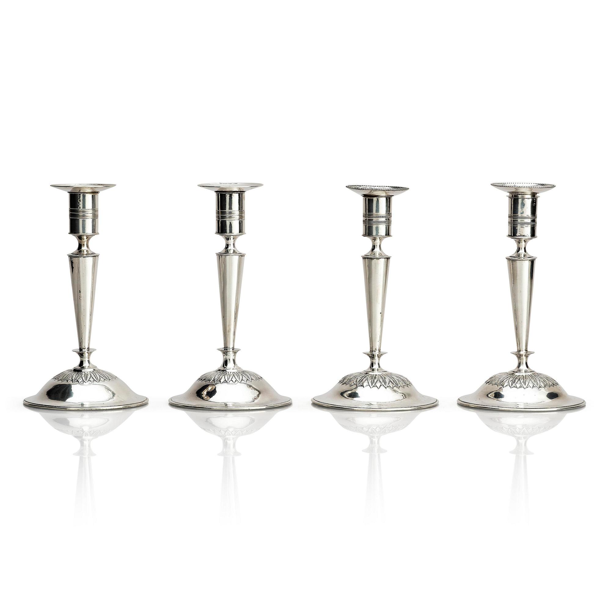 Two pair of early 19th century silver candlesticks, marks of Anders Lundqvist, Stockholm, Sweden 1819 and 1821.