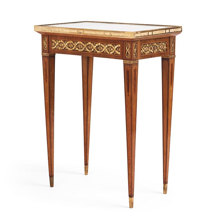 A Gustavian marquetry, ormolu-mounted, and marble table by G. Iwersson (master in Stockholm 1778-1813), signed 1781.