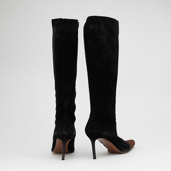 CHRISTIAN DIOR, a pair of black suede boots.