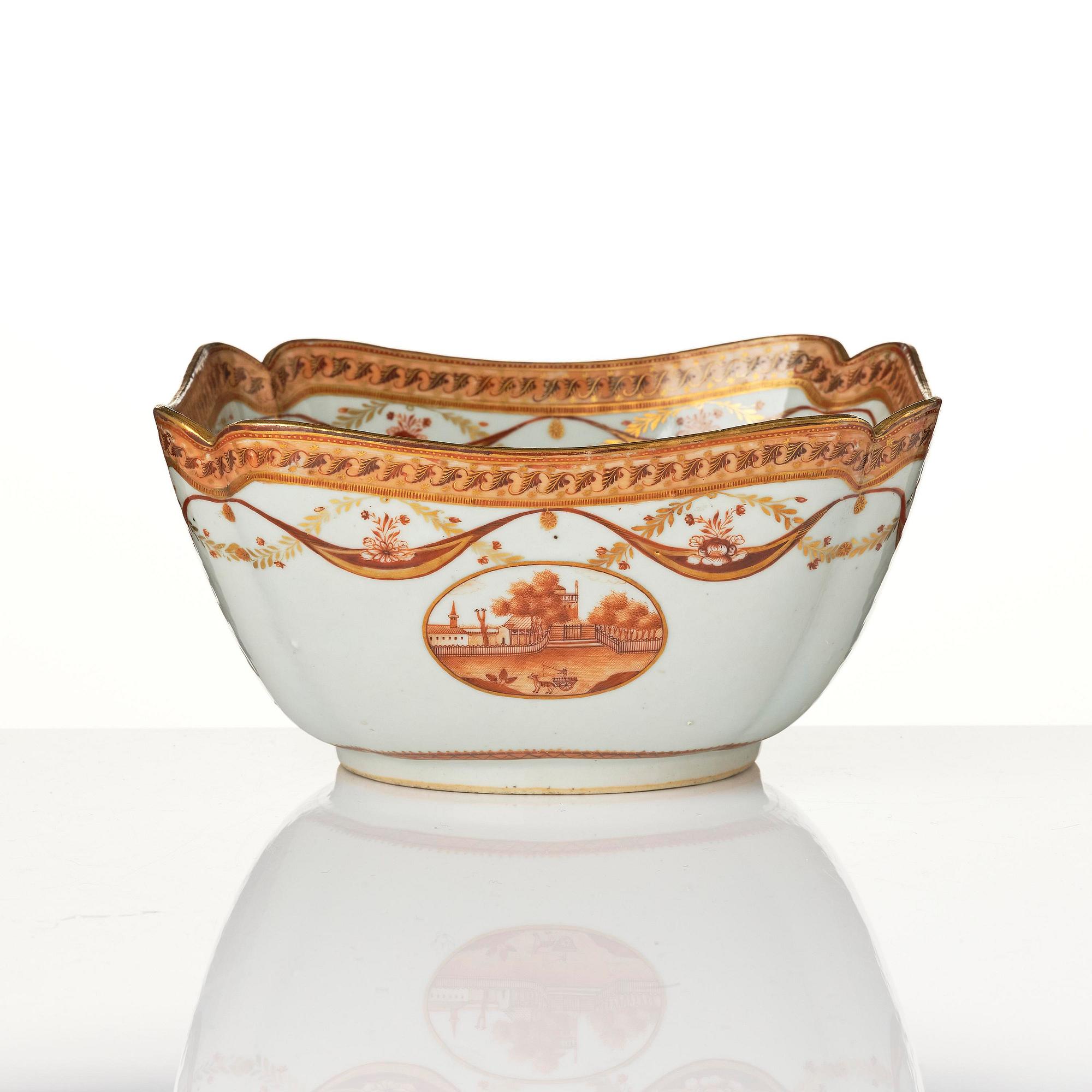 An oval vegetable tureen with cover and a pillow shaped bowl, Qing dynasty, late 18th century.