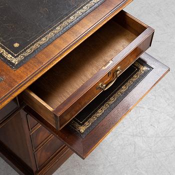 A mahogany desk, Reprodux, England, second half of the 20th Century.