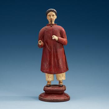 1557. A painted wooden export figure of a China man, Qing dynasty, 18th Century.