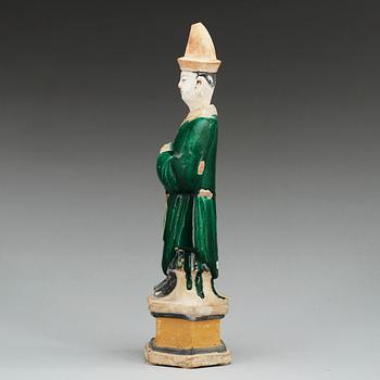 A green and yellow glazed potted figure of a Dignitary, Ming dynasty (1368-1644).