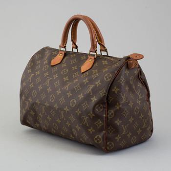 a Louis Vuitton "Speedy 35" bag.