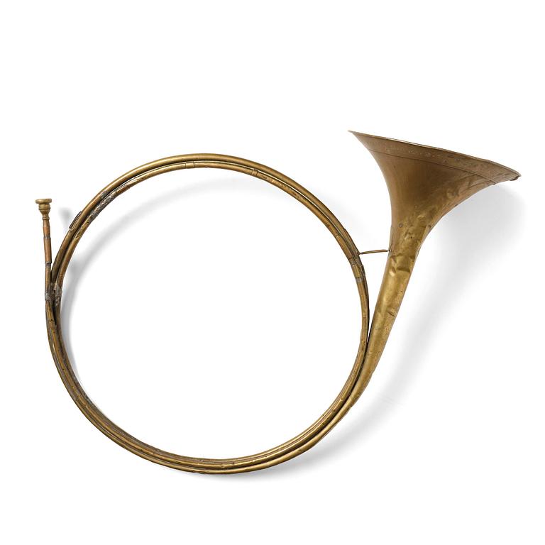 A brass hunting horn by Pierre Raoux (manufacturer of horns in Nancy, fl. ca 1723 -1789.).