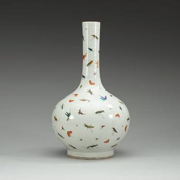 A Chinese butterfly and cricket vase.