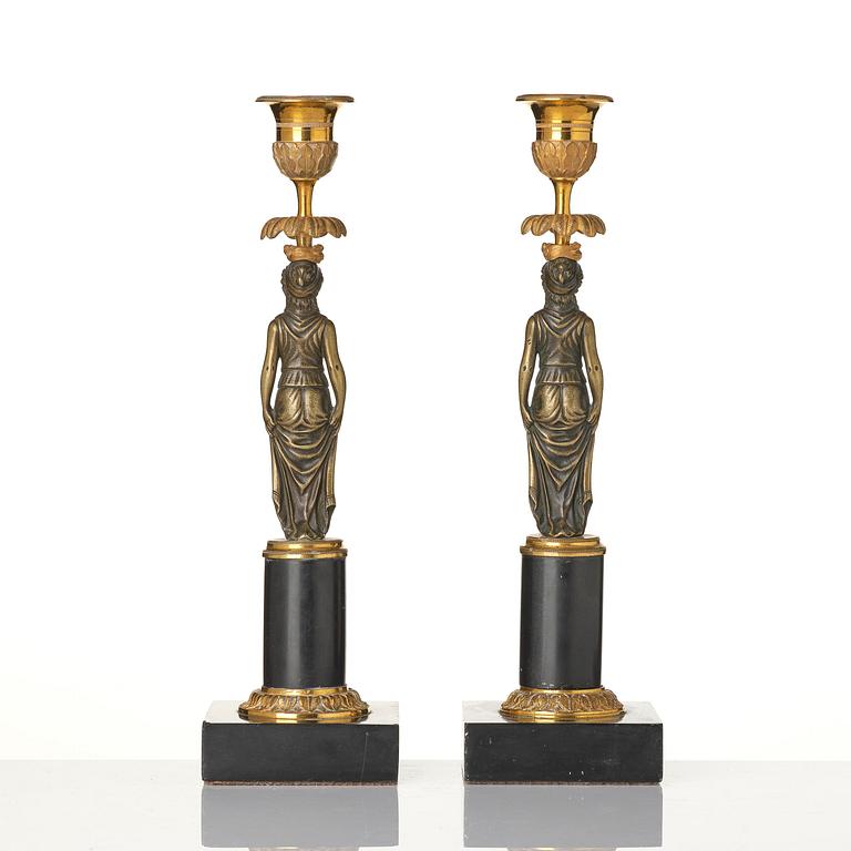 A pair of late Gustavian marble and ormolu candlesticks in the manner of F. L. Rung (1758-1837).