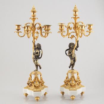 A pair of bronze and marble candelabra, possibly France, late 19th century.