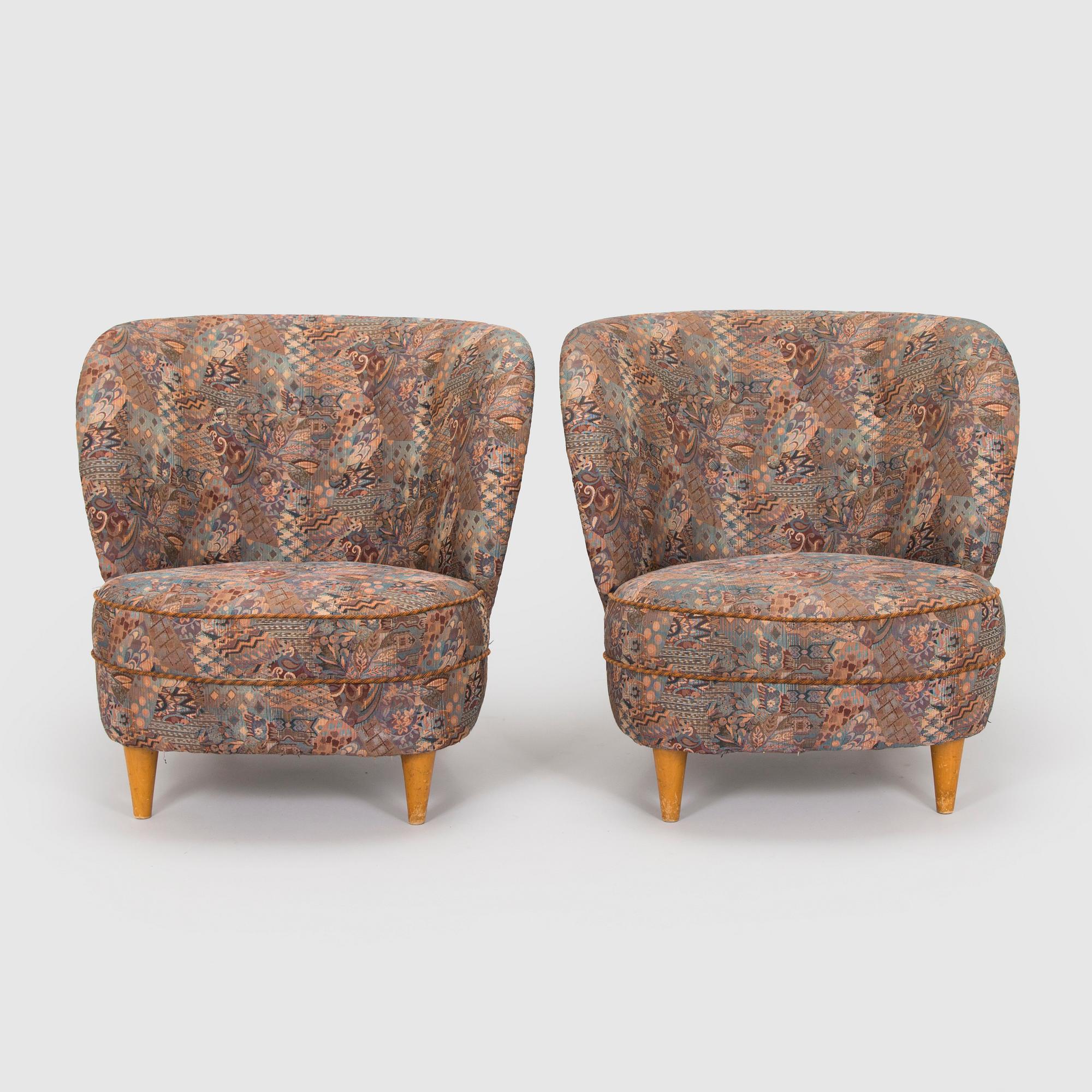 A pair of mid-20th century armchairs.