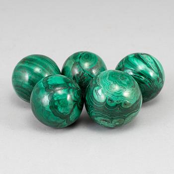 Five malachite balls, 20th century.