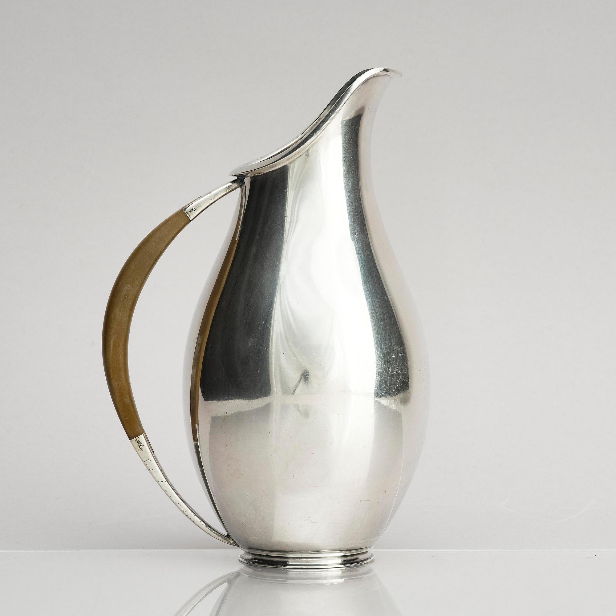 Anton F. Rasmussen, a silver water pitcher with bakelite handle, Aarhus, Denmark, cirka 1950s.