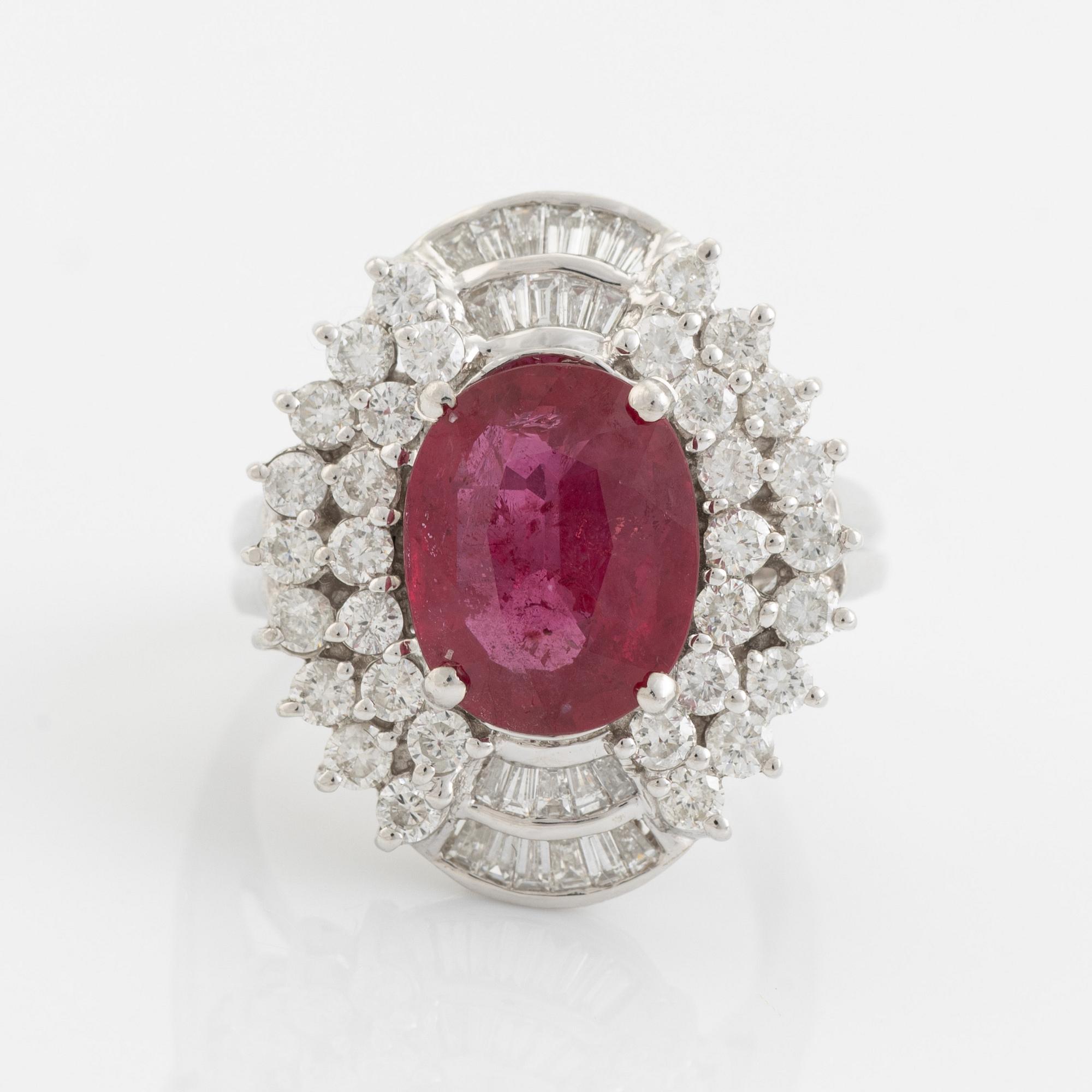 Ruby, baguette- and brilliant cut diamond ring.