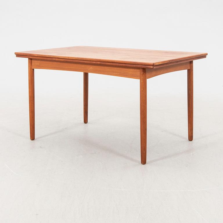 A 1960s teak dining table.