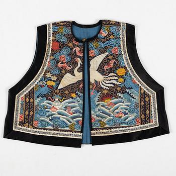 A collar a vest and two Chinese embroidered silk textiles, late Qing dynasty / early 20th century.