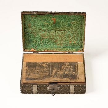A presumably German baroque repoussé brass writing box, late 17th century.