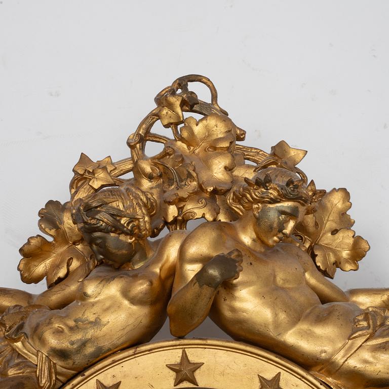 An Empire wall clock, 19th Century.