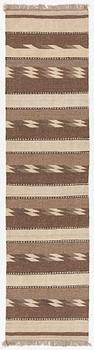 A Persian kilim runner, c. 248 x 62 cm.
