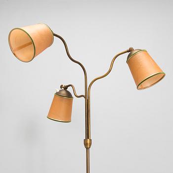 A brass floor lamp, mid-20th century.