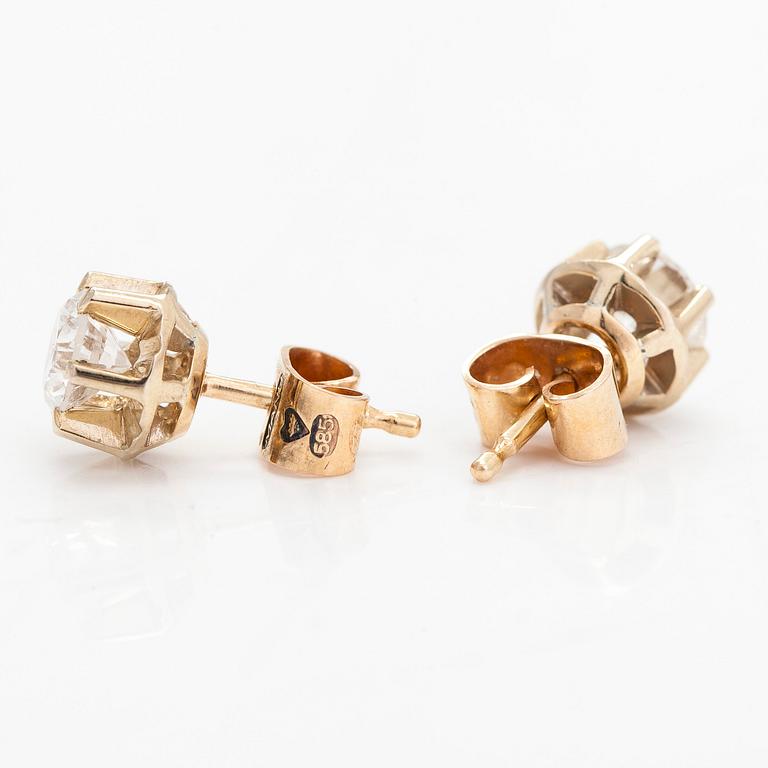 A pair of 14K gold earrings, with brilliant-cut diamonds totalling approximately 1.00 ct. Manu-Koru, Helsinki.