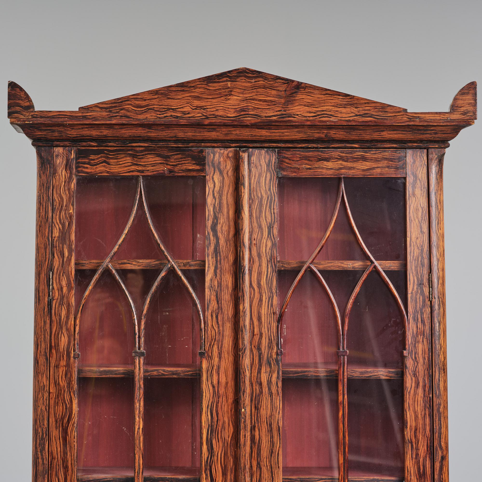 A Swedish faux-boix neo-gothic book cabinet, ca 1830.