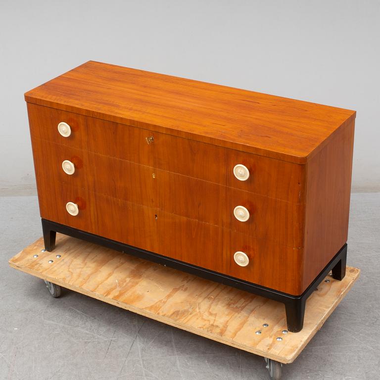 A walnut veneered chest of drawers, 1930's.