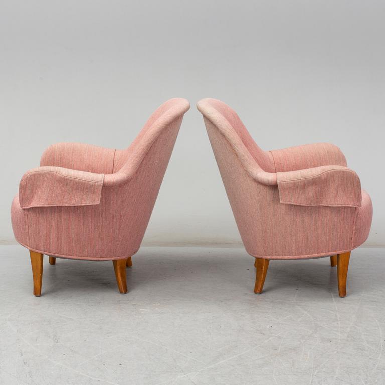 A pair of second half of the 20th Century 'Cirkus' easy chairs by Carl Malmsten.
