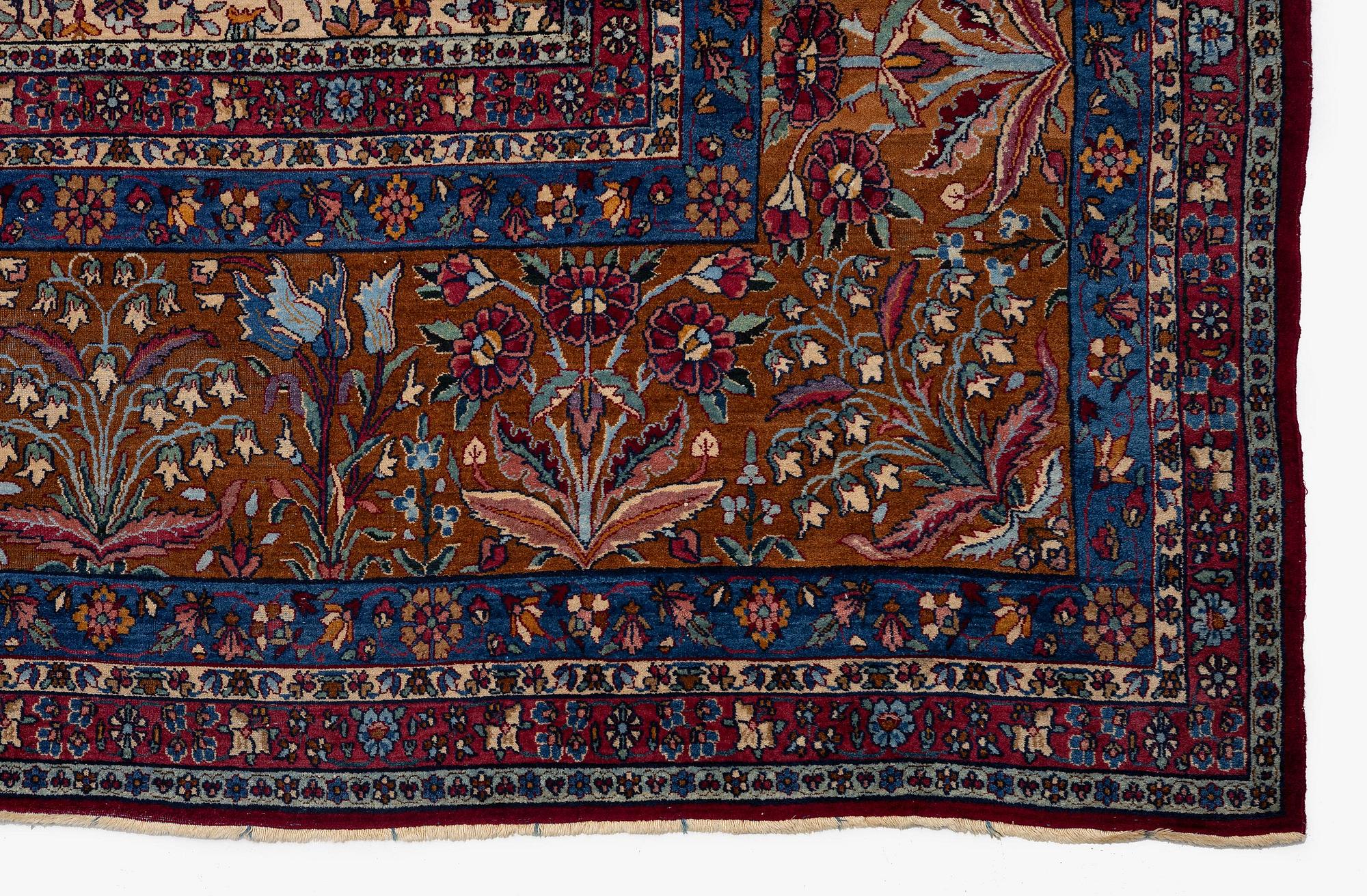 An antique 'Millefleur' Kerman Laver carpet, c. 964 x 426 cm.