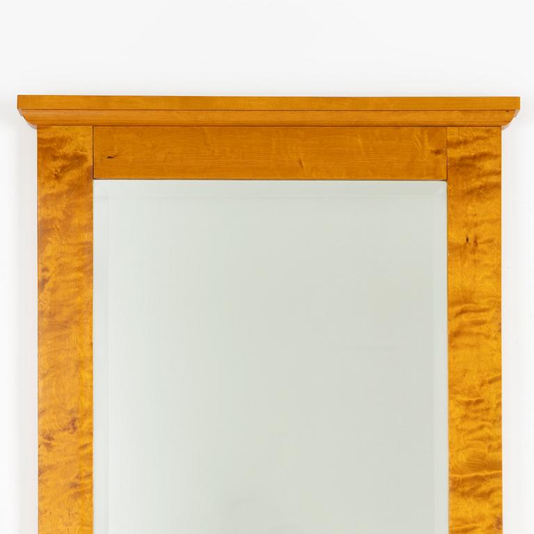 A mirror with console table, early 20th century.