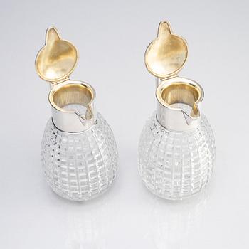 A pair of parcel-gilt silver and "hobnail" crystal decanters, W.A. Bolin, Stockholm 1920.