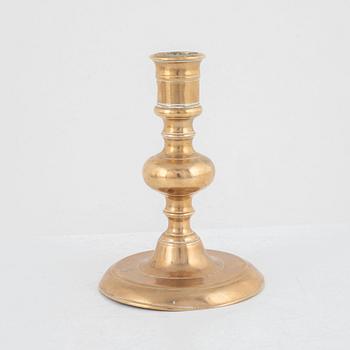 A Baroque brass candlestick, 17th century.