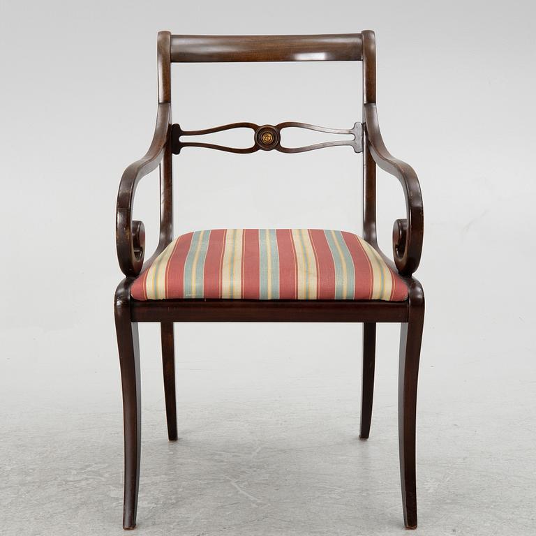 A mahogany veneer desk with desk chair, 20th Century.