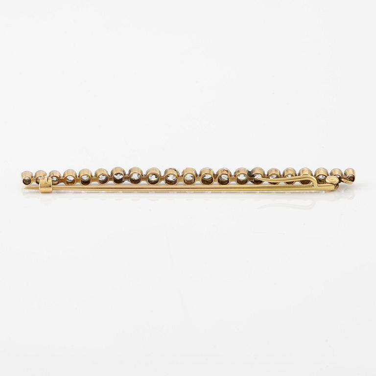 A brooch/pendant, pin, gold and platinum set with old-cut diamonds.