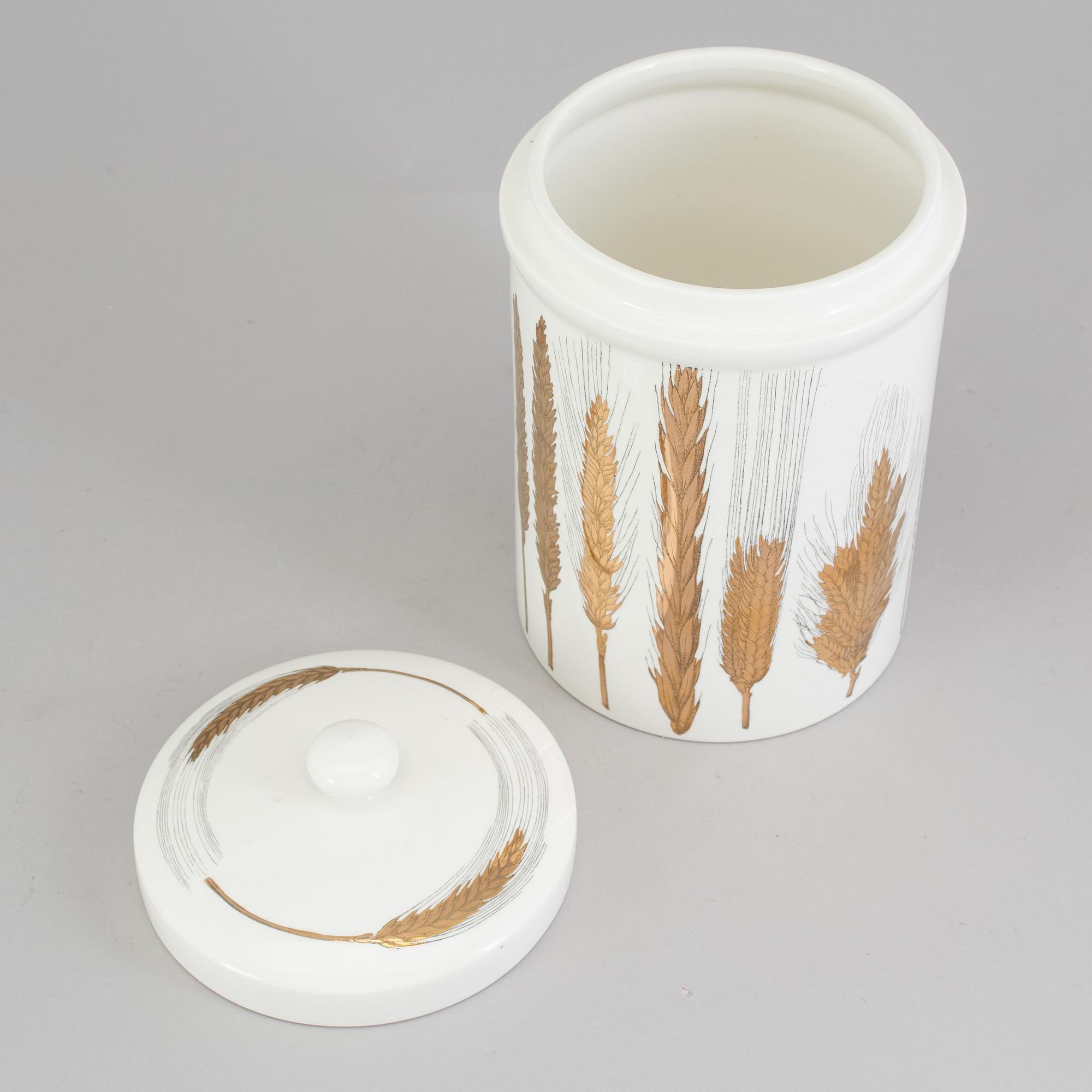 A porcelain jar with lid from Fornasetti, Italy.