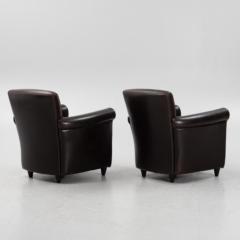 A pair of leather upholstered easy chairs, end of the 20th Century.