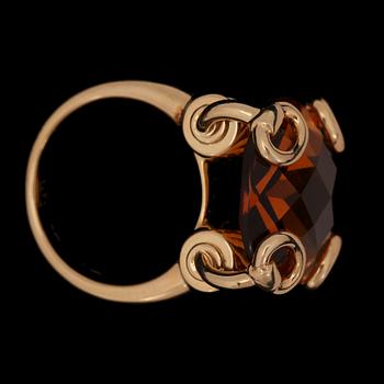 A Gucci ring with checker-cut citrine.