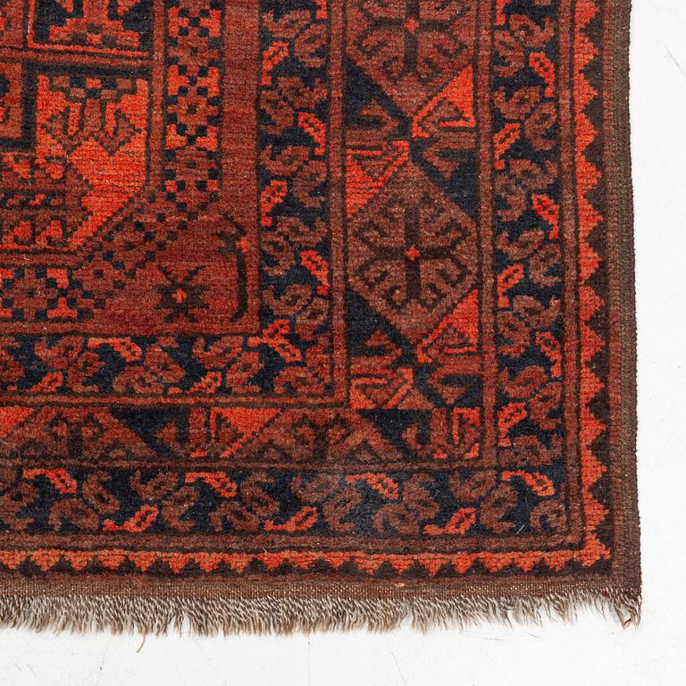 A carpet, semi-antique Afghan, approximately 300 x 221 cm.